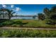 Expansive grassy waterfront lot with scenic views at 118 Harbor View Ln, Belleair Bluffs, FL 33770