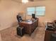 Home office with a desk, chair, and file cabinet at 1753 Belleair Forest Dr # F3, Belleair, FL 33756