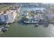 Aerial view of waterfront property with boat and houses at 1866 Venetian Point Dr, Clearwater, FL 33755