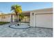 Updated home exterior boasts a modern design, paver driveway, and landscaped entry at 1866 Venetian Point Dr, Clearwater, FL 33755