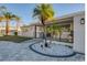 This updated home features a modern exterior, paver driveway, and nicely landscaped entry at 1866 Venetian Point Dr, Clearwater, FL 33755