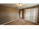 Bedroom featuring neutral tones, carpet flooring, closet and neutral paint at 37670 Aaralyn Rd, Zephyrhills, FL 33542