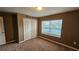 Welcoming bedroom featuring a closet and natural lighting at 37670 Aaralyn Rd, Zephyrhills, FL 33542