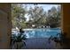 Inviting community pool with lounge chairs at 37670 Aaralyn Rd, Zephyrhills, FL 33542