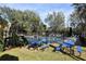 Two blue picnic tables by the community pool at 37670 Aaralyn Rd, Zephyrhills, FL 33542