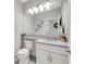 Simple bathroom with white vanity and toilet at 4735 Avila Lakes Dr, Wimauma, FL 33598