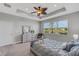 Main bedroom with large window and dresser at 4735 Avila Lakes Dr, Wimauma, FL 33598