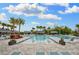 Resort-style pool with multiple areas for swimming and relaxing at 4735 Avila Lakes Dr, Wimauma, FL 33598