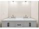 Modern bathroom with double vanity and quartz countertop at 712 E Madison St, Plant City, FL 33563