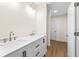 Double vanity bathroom with marble countertop and a hallway view at 712 E Madison St, Plant City, FL 33563