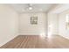 Well-lit bedroom with hardwood floors and a ceiling fan at 712 E Madison St, Plant City, FL 33563