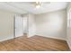 Simple bedroom with hardwood floors and ceiling fan at 712 E Madison St, Plant City, FL 33563