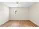 Bright bedroom featuring hardwood floors and a ceiling fan at 712 E Madison St, Plant City, FL 33563