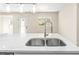 Modern double sink with a sleek faucet and white quartz countertops at 712 E Madison St, Plant City, FL 33563