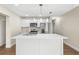 Modern kitchen with white cabinets and a large island at 712 E Madison St, Plant City, FL 33563