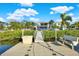 Private dock with walkway to the house at 7145 Peninsular Dr, New Port Richey, FL 34652