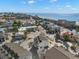 Aerial view of coastal neighborhood, showcasing beach proximity and various house styles at 9901 1St E St # F, Treasure Island, FL 33706