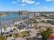 Aerial view of townhomes near the water with a parking area at 9901 1St E St # F, Treasure Island, FL 33706