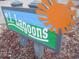 T.I. Lagoons community sign with a colorful sun design at 9901 1St E St # F, Treasure Island, FL 33706