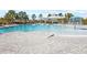 Community pool with a covered patio and a fun splash pad at 10675 Hawks Landing Dr, Land O Lakes, FL 34638