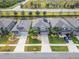 Houses with gray roofs, solar panels and palm trees at 11411 Alachua Creek Ln, Riverview, FL 33579