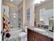 Clean bathroom with granite countertop and bathtub at 11411 Alachua Creek Ln, Riverview, FL 33579