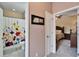 Bathroom with shower/tub and floral shower curtain at 11411 Alachua Creek Ln, Riverview, FL 33579