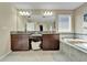 Bathroom with double vanity and a large soaking tub at 11411 Alachua Creek Ln, Riverview, FL 33579