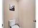 Small half bathroom with toilet and sink at 11411 Alachua Creek Ln, Riverview, FL 33579