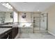 Spa-like bathroom with a large soaking tub and a walk-in shower at 11411 Alachua Creek Ln, Riverview, FL 33579
