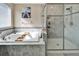 Bathroom with a large soaking tub and a separate shower at 11411 Alachua Creek Ln, Riverview, FL 33579