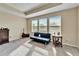 Bright bedroom with a comfortable sofa and plenty of natural light at 11411 Alachua Creek Ln, Riverview, FL 33579