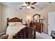 Bedroom with wooden furniture and ceiling fan at 11411 Alachua Creek Ln, Riverview, FL 33579