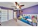 Spacious bedroom with built-in shelves and a full-size bed at 11411 Alachua Creek Ln, Riverview, FL 33579
