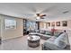 Bonus room featuring a large sectional sofa and built-in shelving at 11411 Alachua Creek Ln, Riverview, FL 33579