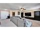 Bonus room with sectional sofa and large TV at 11411 Alachua Creek Ln, Riverview, FL 33579