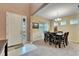 Dining room with a wooden table, six chairs, and a chandelier at 11411 Alachua Creek Ln, Riverview, FL 33579