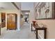 Bright entryway with high ceilings and a world map painting at 11411 Alachua Creek Ln, Riverview, FL 33579