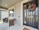 Black front door with a stylish wreath and sidelights at 11411 Alachua Creek Ln, Riverview, FL 33579