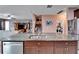 Open concept kitchen with island, granite countertops, and stainless steel appliances at 11411 Alachua Creek Ln, Riverview, FL 33579