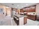 Island kitchen with granite countertops, stainless steel appliances, and breakfast bar at 11411 Alachua Creek Ln, Riverview, FL 33579