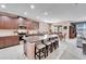 Island kitchen with granite countertops, stainless steel appliances, and breakfast bar at 11411 Alachua Creek Ln, Riverview, FL 33579