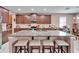 Large kitchen island with granite countertops and seating for four at 11411 Alachua Creek Ln, Riverview, FL 33579