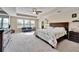 Main bedroom with a king-size bed and sitting area at 11411 Alachua Creek Ln, Riverview, FL 33579