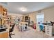 Spacious home office with built-in shelving and workspaces at 11411 Alachua Creek Ln, Riverview, FL 33579