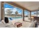 Covered patio with pool and comfortable seating at 11411 Alachua Creek Ln, Riverview, FL 33579
