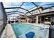 Relaxing pool and patio with covered seating at 11411 Alachua Creek Ln, Riverview, FL 33579