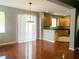 Bright dining area with hardwood floors and kitchen views at 19538 Timberbluff Dr, Land O Lakes, FL 34638