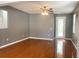 Bright living room with hardwood floors and neutral walls at 19538 Timberbluff Dr, Land O Lakes, FL 34638