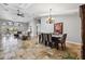 Spacious dining room with tile floors and a chandelier at 224 7Th E St, St Petersburg, FL 33715